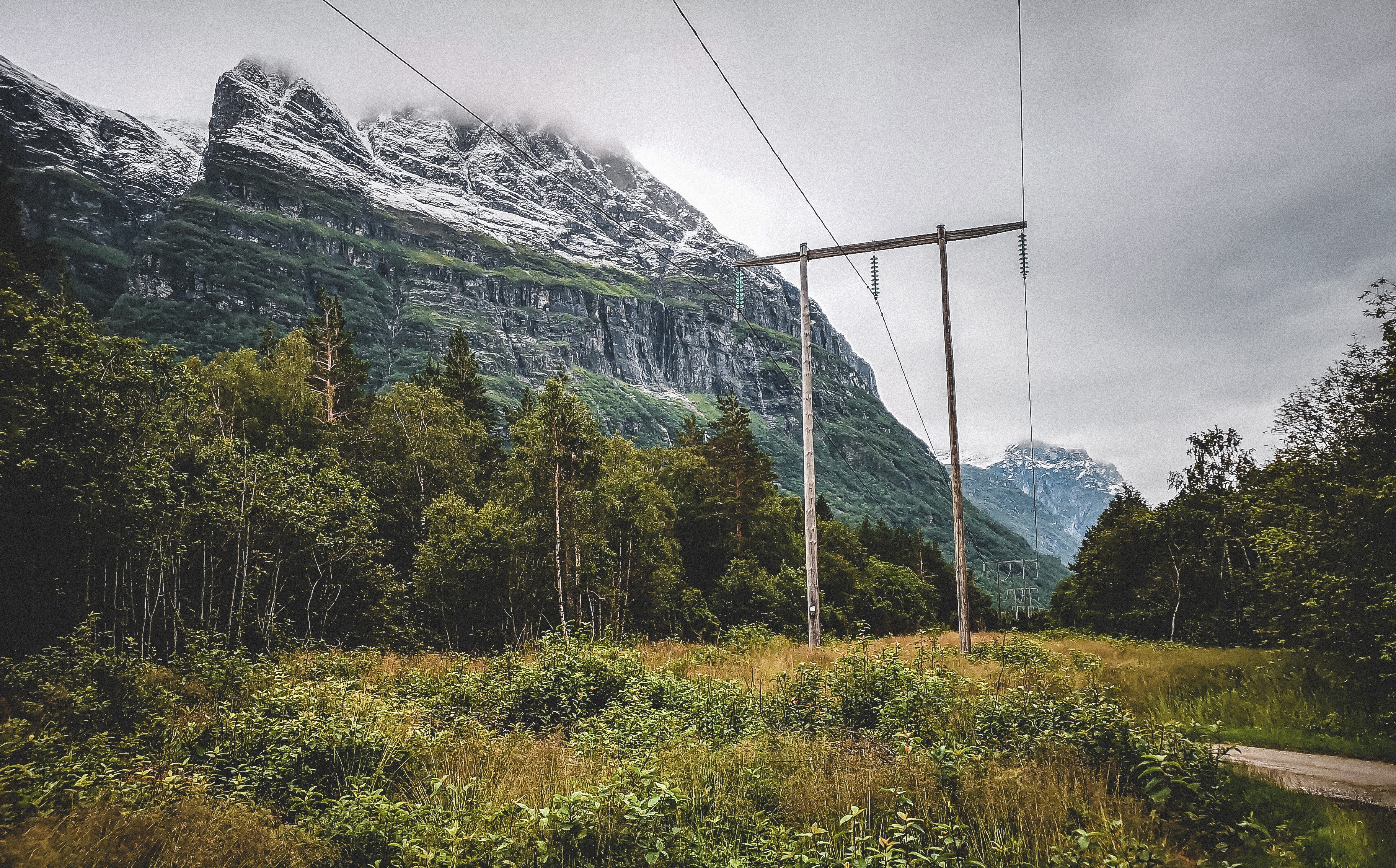 Power line with mountains in the back